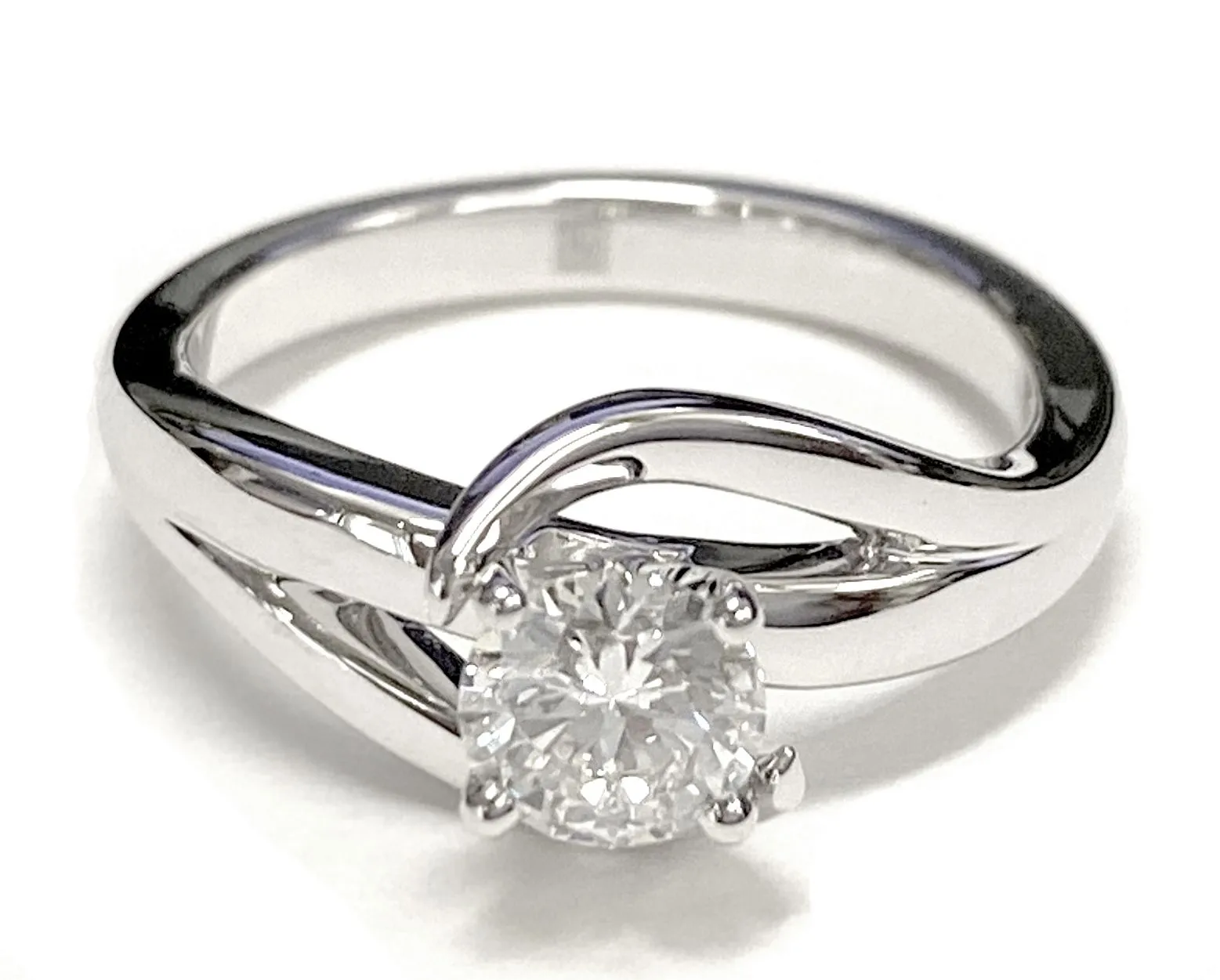 Platinum Round Brilliant  Asymetical Bypass Solitaire Twist Engagement Ring
